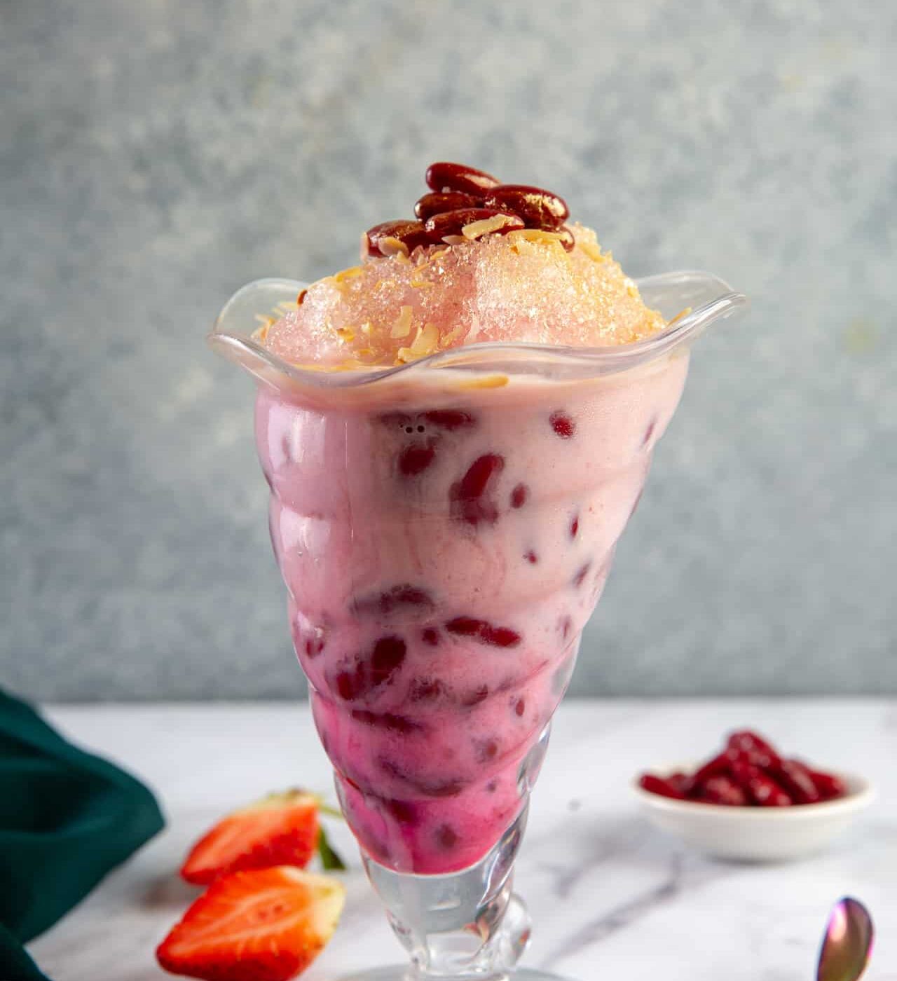 Glass filled with red bean shaved ice smoothie at Tenggara