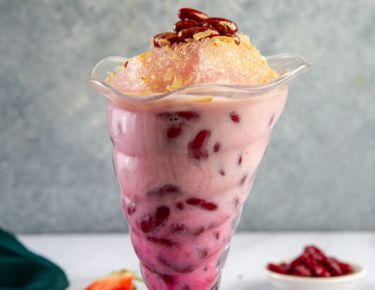 Glass filled with red bean shaved ice smoothie at Tenggara