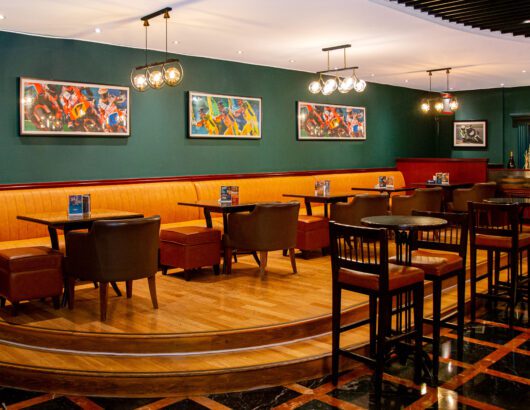 Table seating at The Grandstand Sports Bar at Park Regis Kris Kin