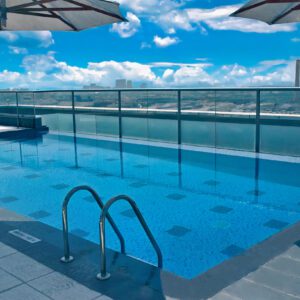 Park Regis Kris Kin rooftop swimming pool with Dubai skyline